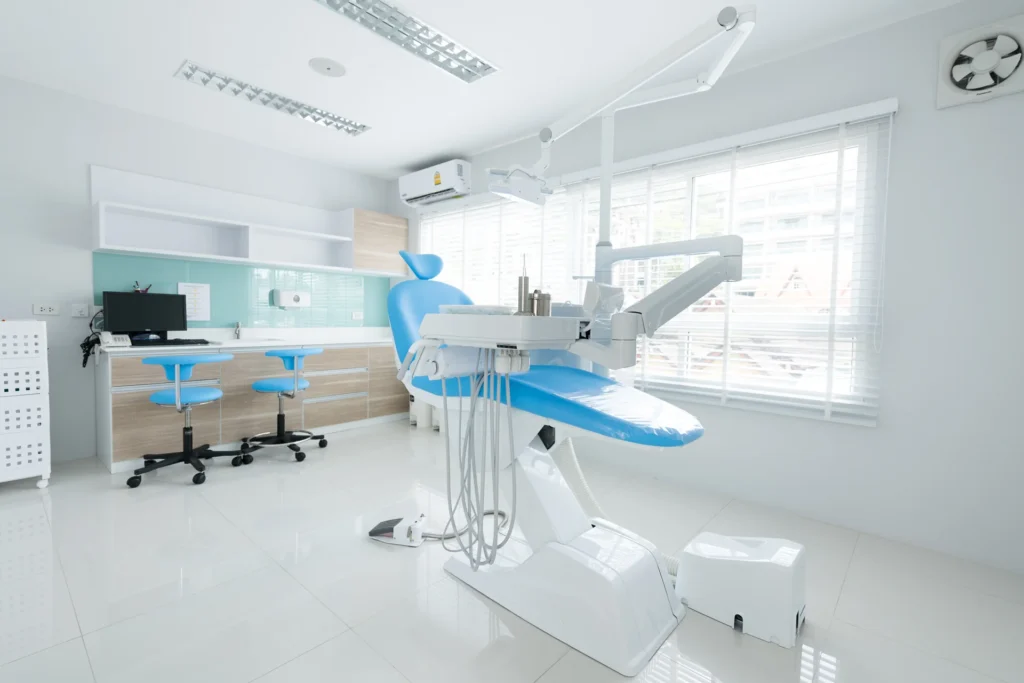 Modern style interior shot of dental clinic with blue dental chair.